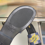 Louis Vuitton slide sandal footbed close-up with Louis Vuitton Paris logo text
