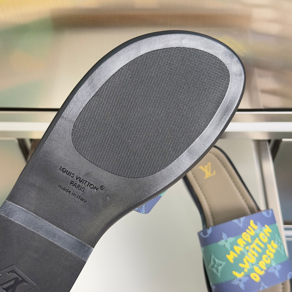 Louis Vuitton slide sandal outsole with gray rubber tread and black sidewall