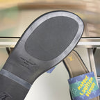 Louis Vuitton slide sandal outsole with gray rubber tread and black sidewall