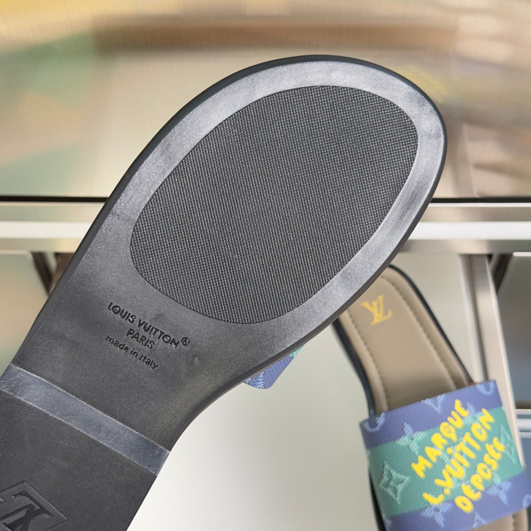 Louis Vuitton slide sandal outsole with gray rubber tread and black sidewall