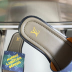 Louis Vuitton sandal strap close-up with beige footbed and gold LV logo stitching