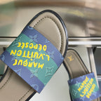 Louis Vuitton sandal close-up with multicolor monogram strap over beige footbed