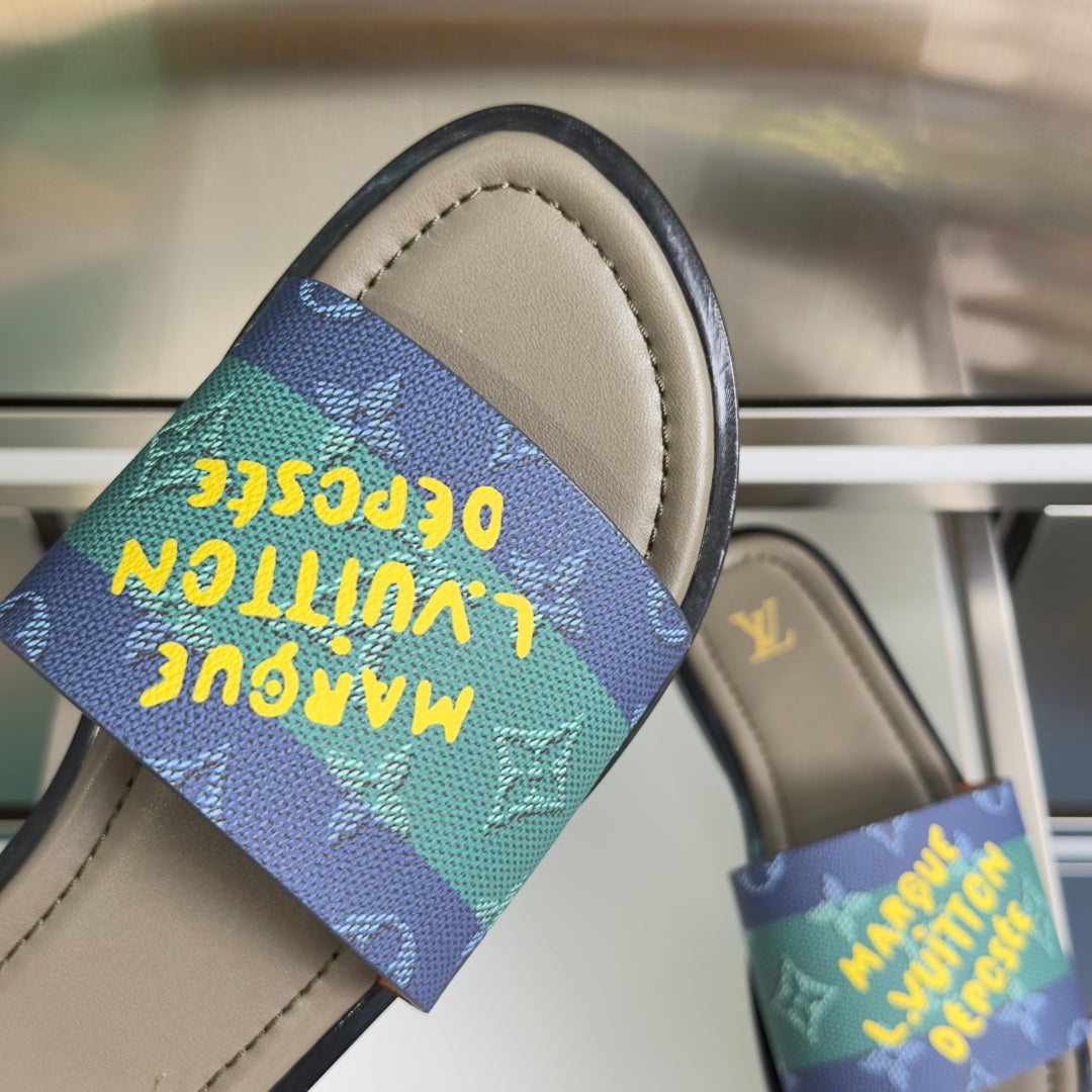 Louis Vuitton sandal close-up with multicolor monogram strap over beige footbed