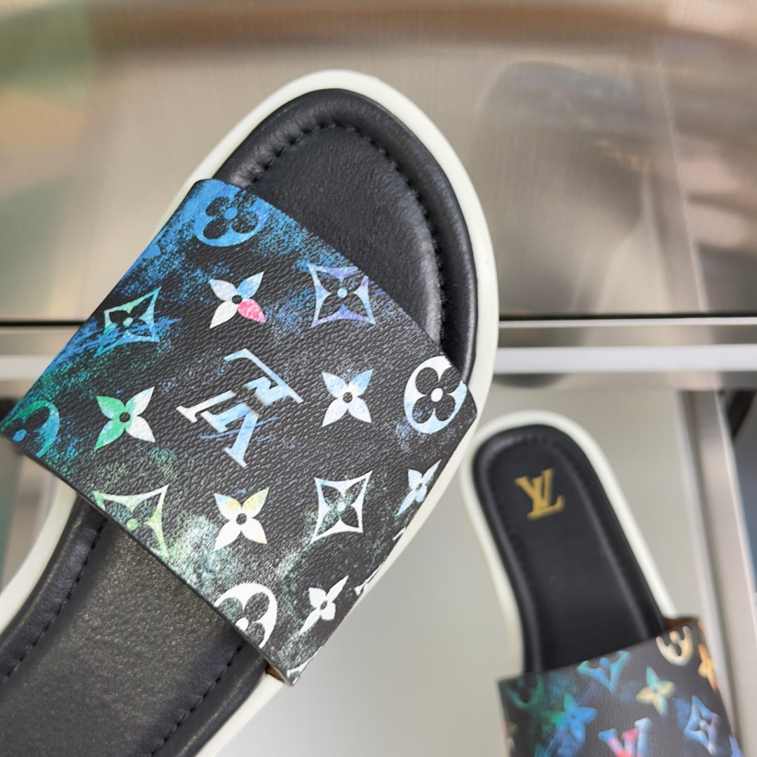 Louis Vuitton sandal with black strap and multicolor butterfly pattern over cushioned footbed