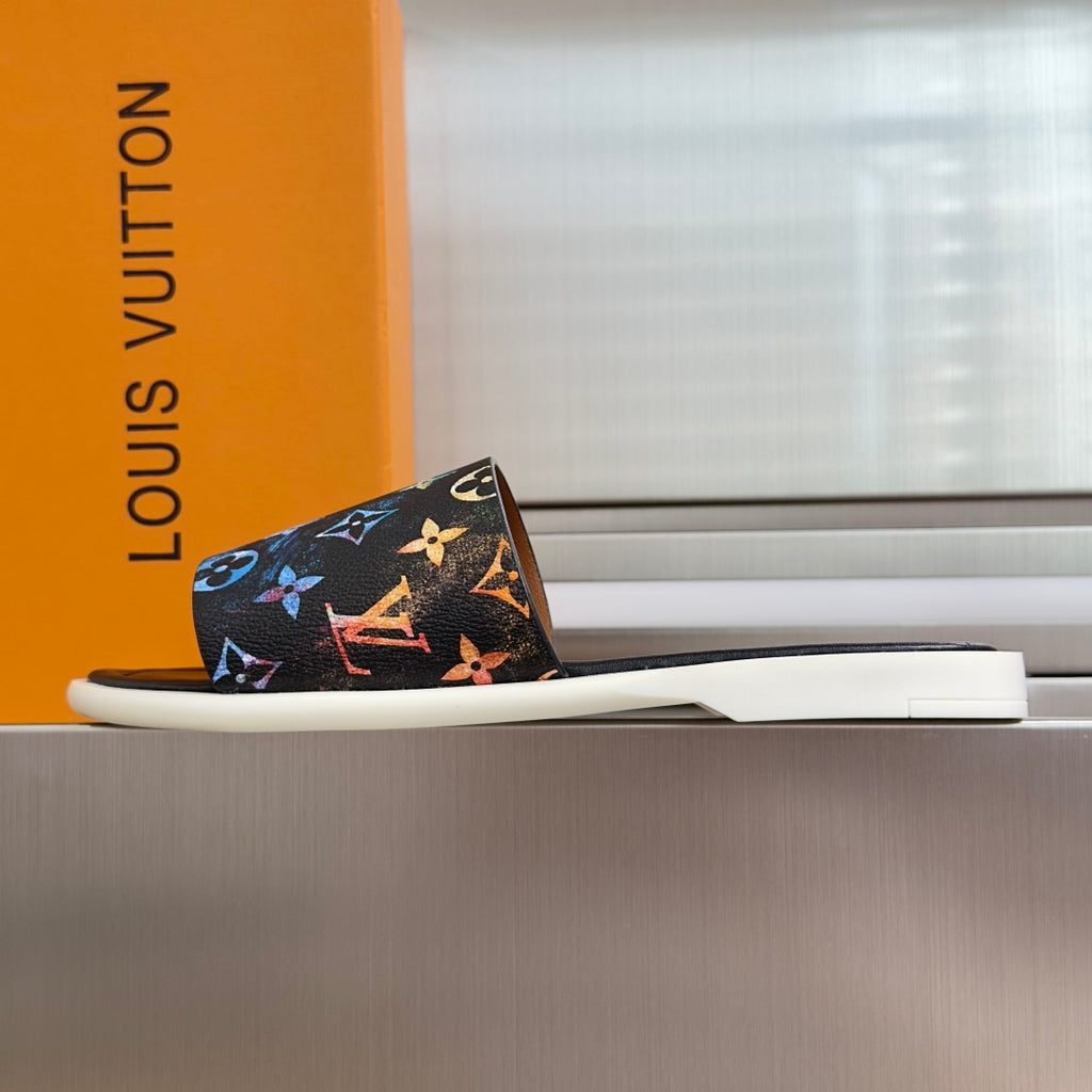 Louis Vuitton slide sandals in black with multicolor butterfly and logo print