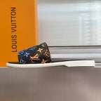 Louis Vuitton slide sandals in black with multicolor butterfly and logo print