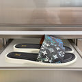 Louis Vuitton slide sandals with black monogram floral print and white sole