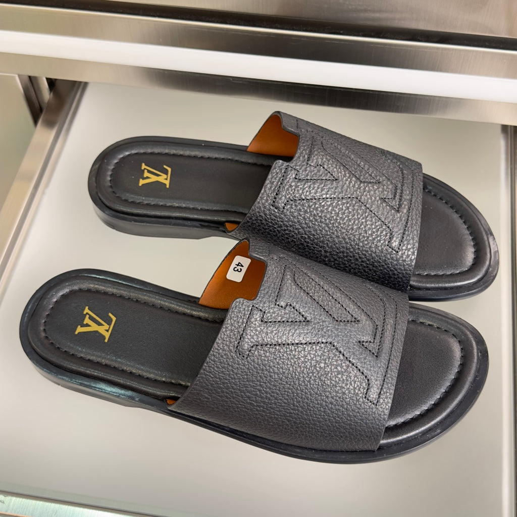 Gray leather slide sandals with double wide strap and gold LV logo detailing