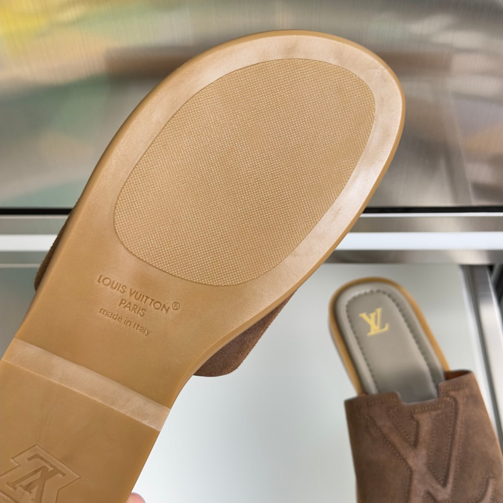 Suede slide sandal footbed with embossed Louis Vuitton text and made-in-Italy mark