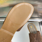 Suede slide sandal footbed with embossed Louis Vuitton text and made-in-Italy mark