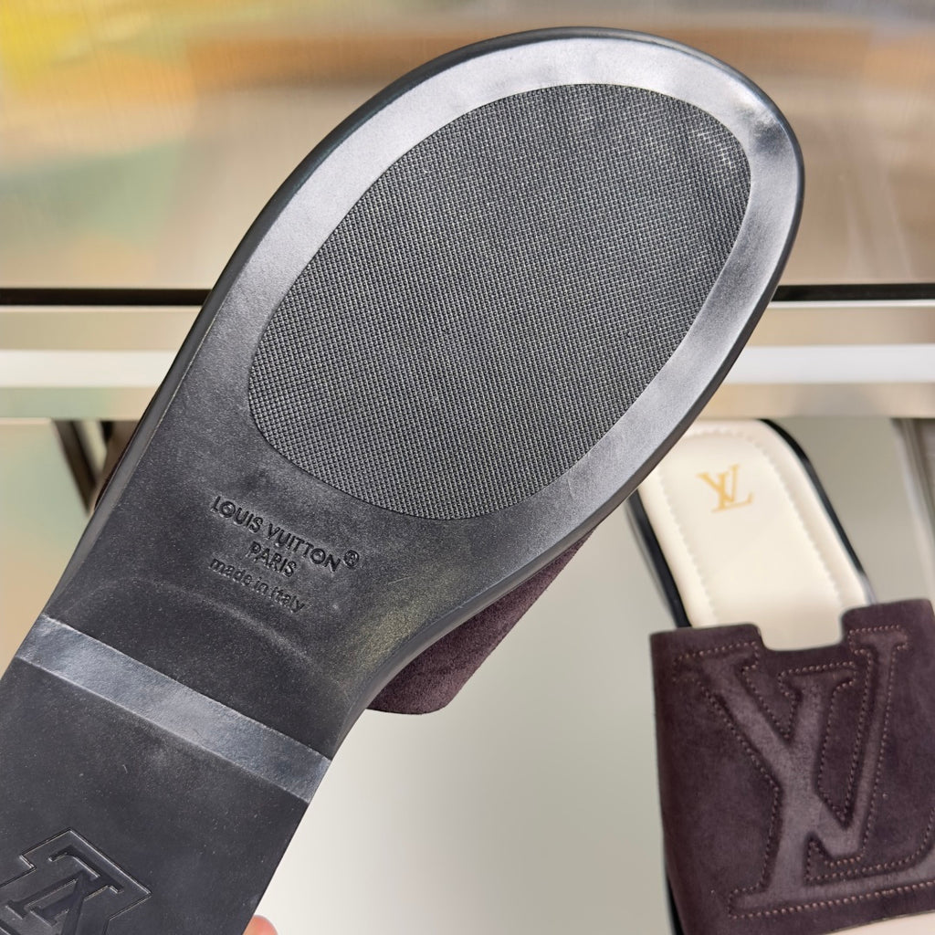 Rubber outsole underside with Louis Vuitton logo on dark purple slide sandals