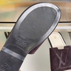 Rubber outsole underside with Louis Vuitton logo on dark purple slide sandals