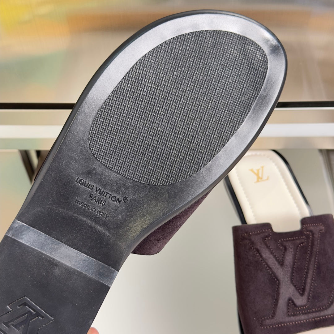 Rubber outsole underside with Louis Vuitton logo on dark purple slide sandals