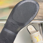 Louis Vuitton sandal outsole, dark rubber footbed with LV logo text