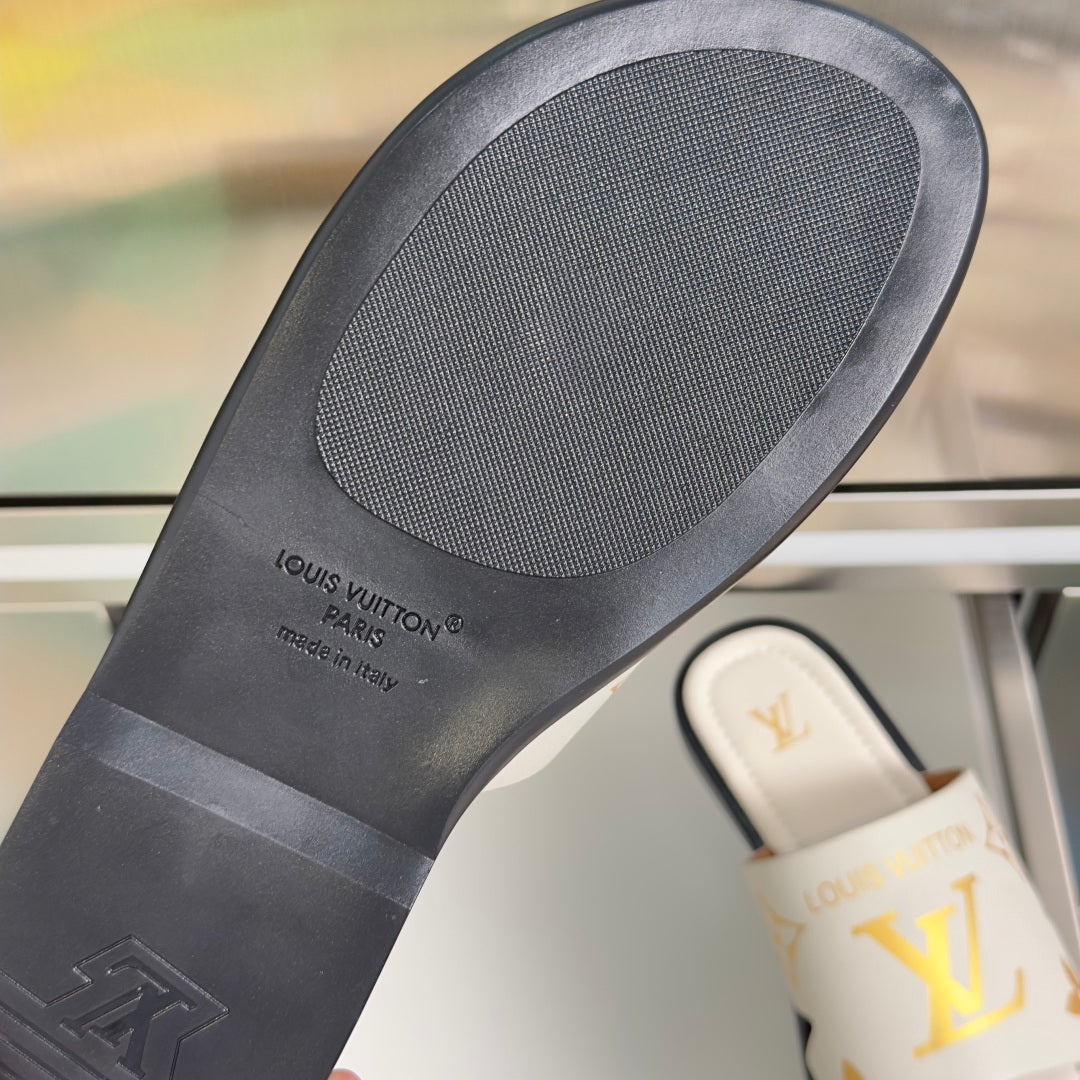 Louis Vuitton sandal outsole, dark rubber footbed with LV logo text