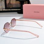 Sunglasses with rose-gold metal frame and pink-tinted lenses, clear temples
