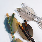 Assorted sunglasses close-up with gold frames and blue and brown mirrored lenses