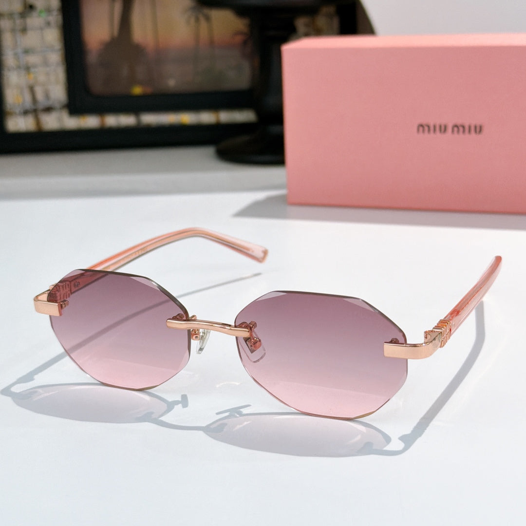 Sunglasses with pink acetate frames and pink tinted lenses, gold-tone hinges