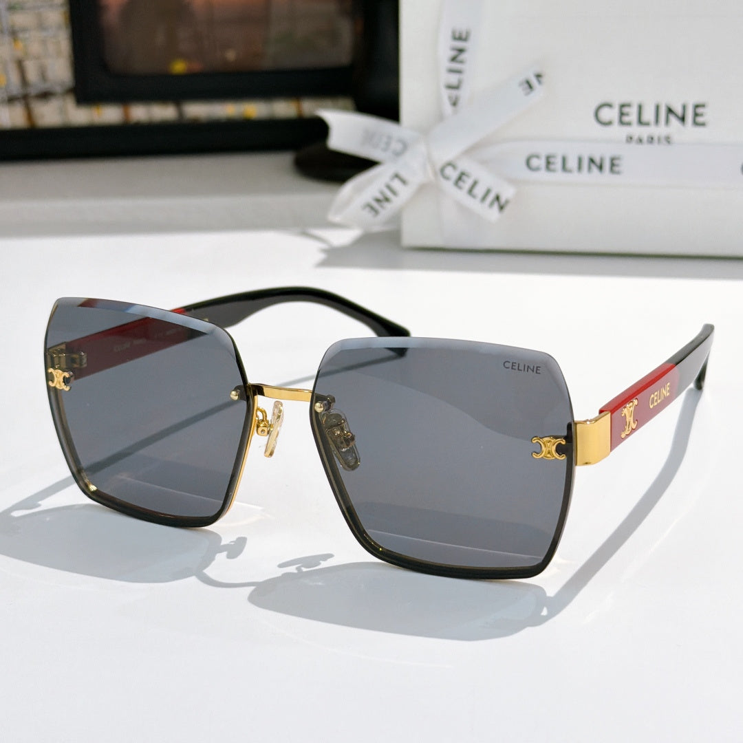 Celine sunglasses with gold-tone frame and gray gradient lenses, red temple accent detail
