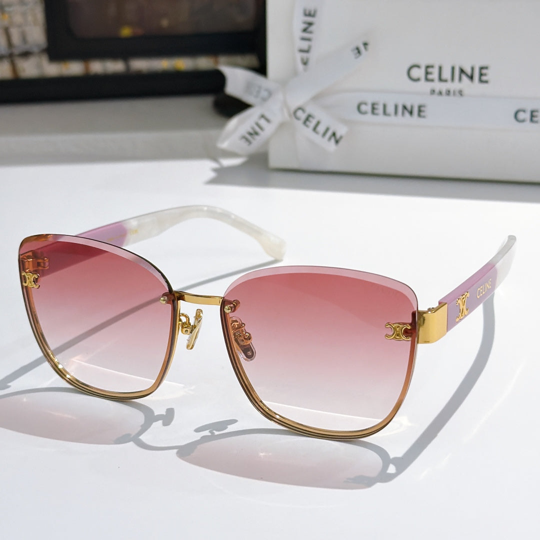 Gold-rim cat-eye sunglasses with pink gradient lenses and clear arms