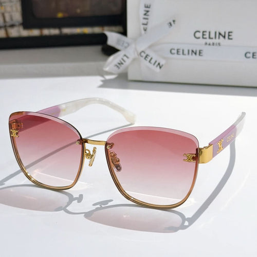Gold-rim cat-eye sunglasses with pink gradient lenses and clear arms