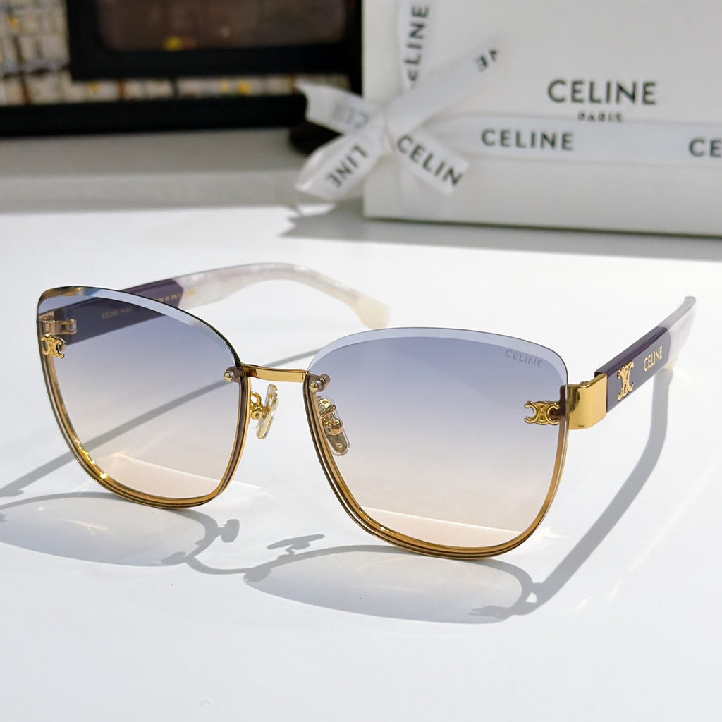 Gold-rim cat-eye sunglasses with blue gradient lenses and clear temples