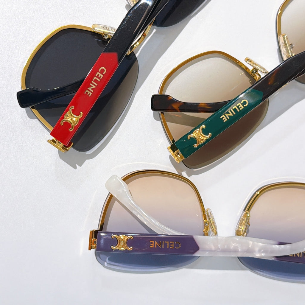 Assorted cat-eye sunglasses with gold rims and colored temple bands