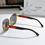 Side-view cat-eye sunglasses with dark lenses, red temple band, and gold tips