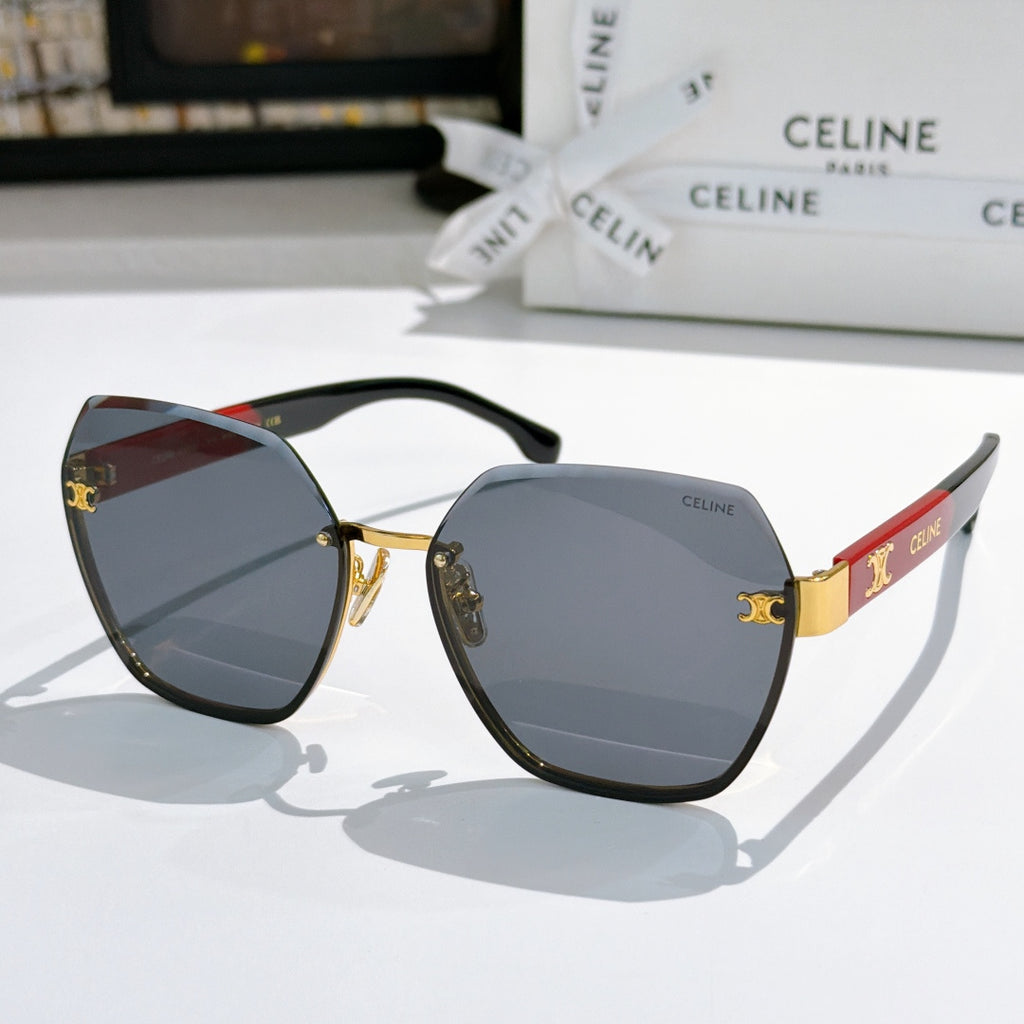 Celine sunglasses with black frame, gold-tone accents, and blue-gray gradient lenses