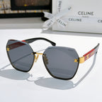 Celine sunglasses with black frame, gold-tone accents, and blue-gray gradient lenses