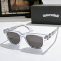 Chrome-frame sunglasses with dark lenses and clear temples