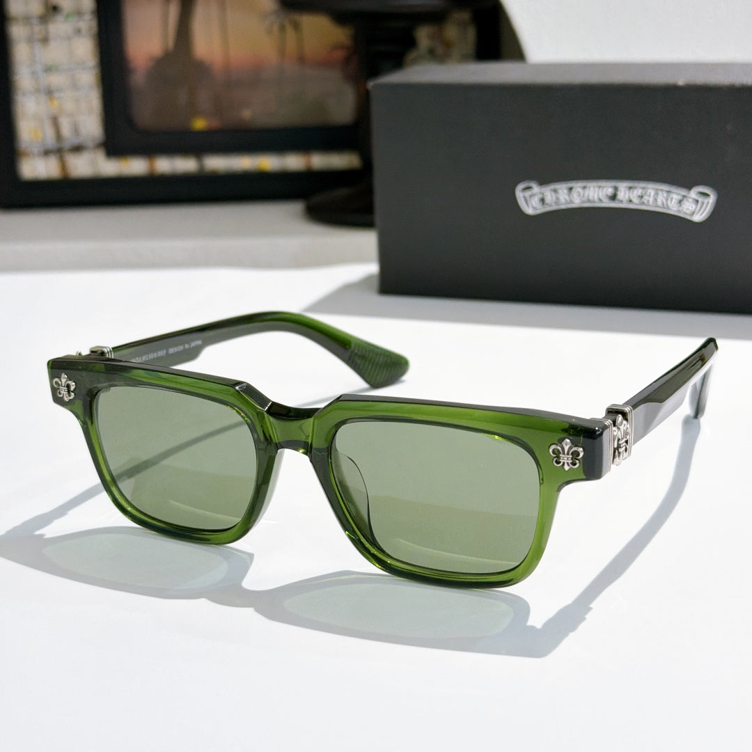 Green-frame sunglasses with tinted green lenses and gold-tone logo accents