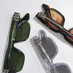 Overlapping sunglasses with green, tortoiseshell, and clear frames and tinted lenses