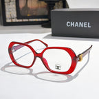 Chanel eyeglasses, red rounded-square frames with gold-tone temple logo and clear lenses