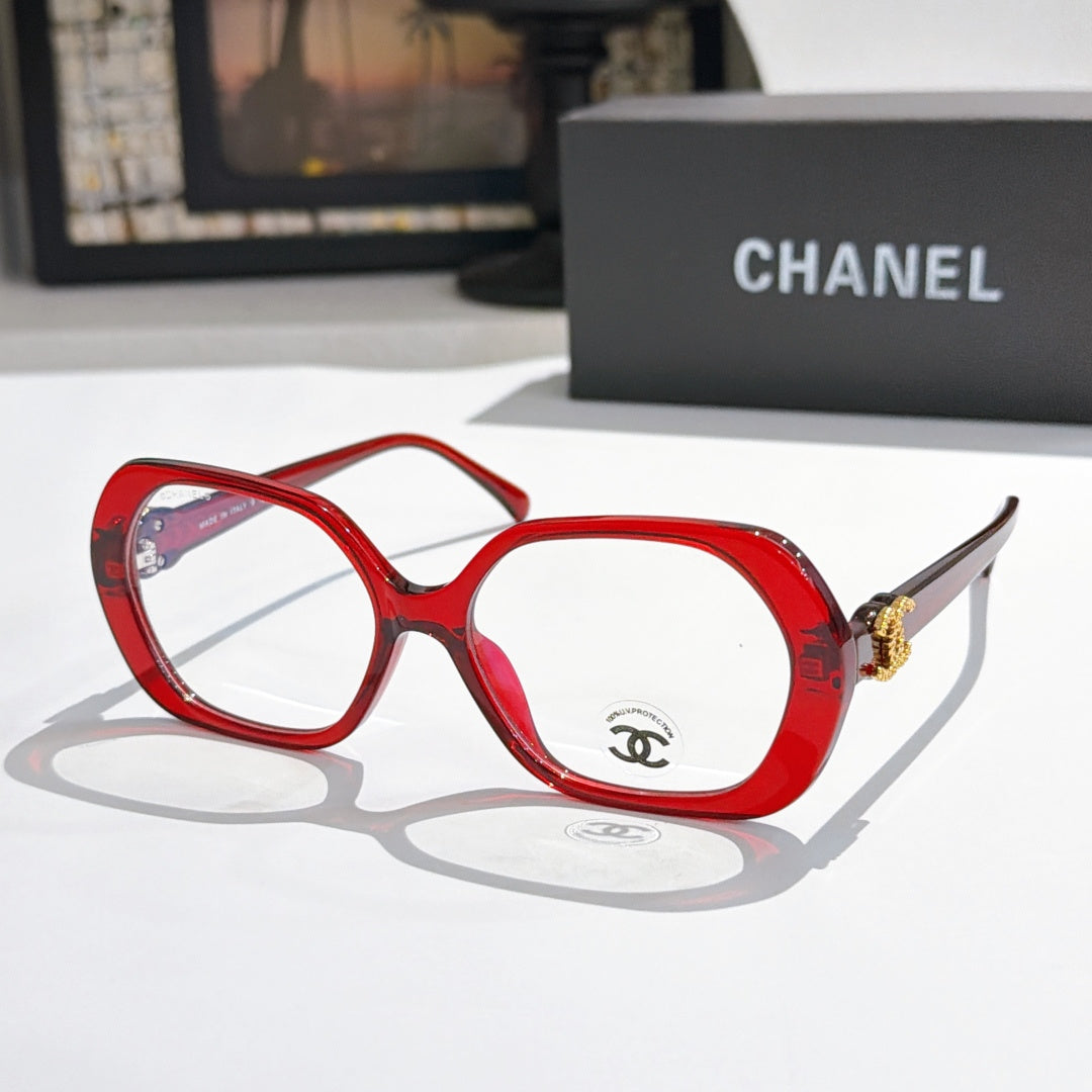Chanel eyeglasses, red rounded-square frames with gold-tone temple logo and clear lenses