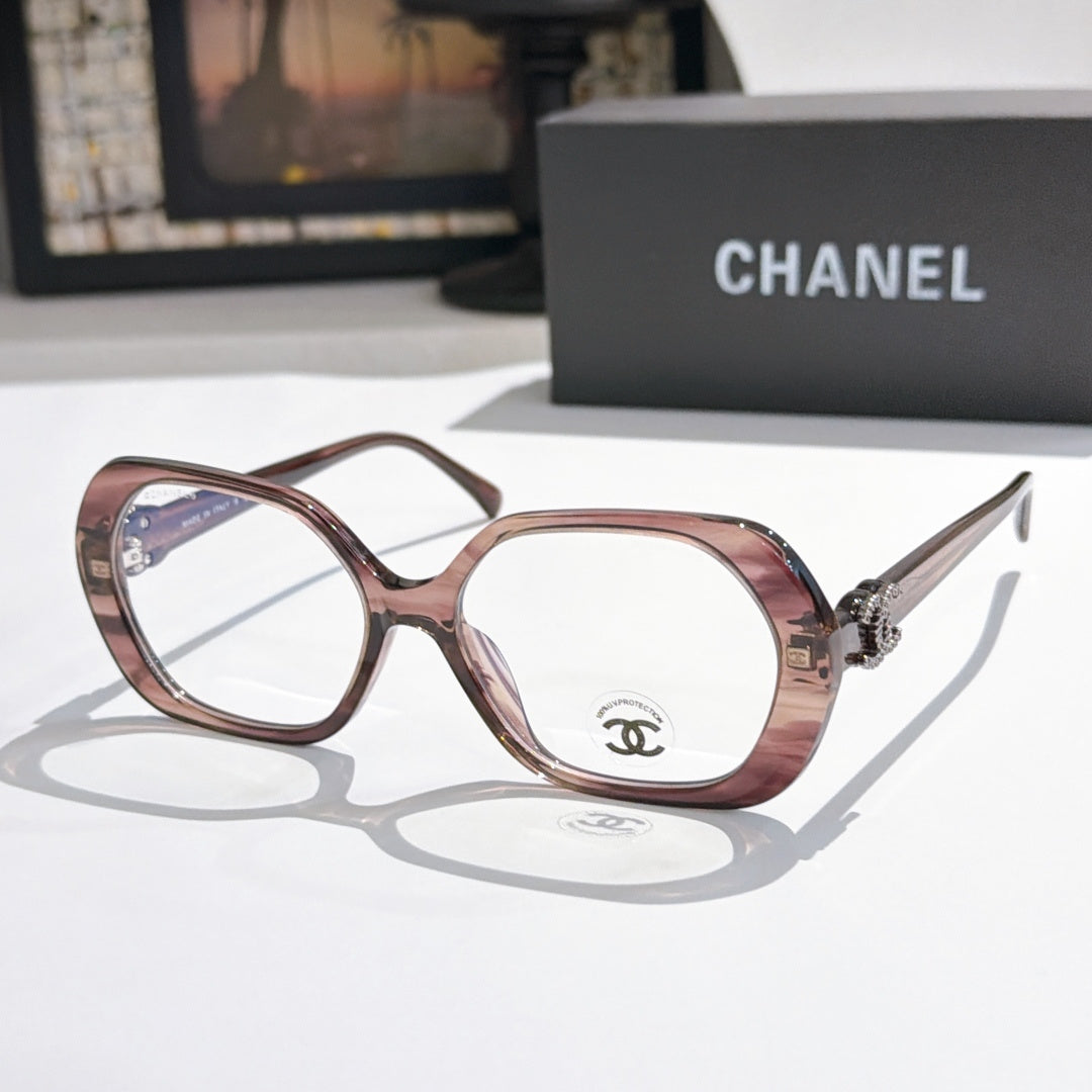 Chanel eyeglasses, rose frames with gold-tone temple logo and clear lenses