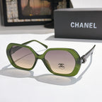 Chanel sunglasses, olive-green frames, pink-tinted lenses, gold logo detail.