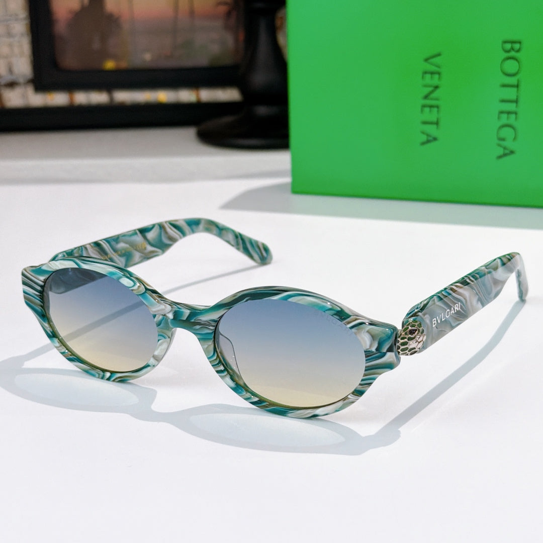Bottega Veneta sunglasses, teal marbled frames with gradient light-blue lenses