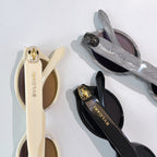 Bvlgari glasses temples with gold emblem, cream and black frames