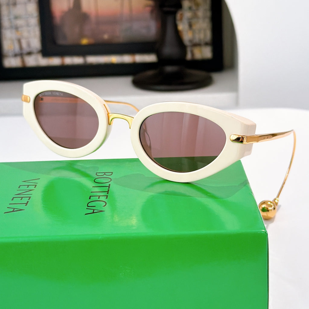 Bottega Veneta glasses with light cream frames and mauve tinted lenses, gold-tone hardware