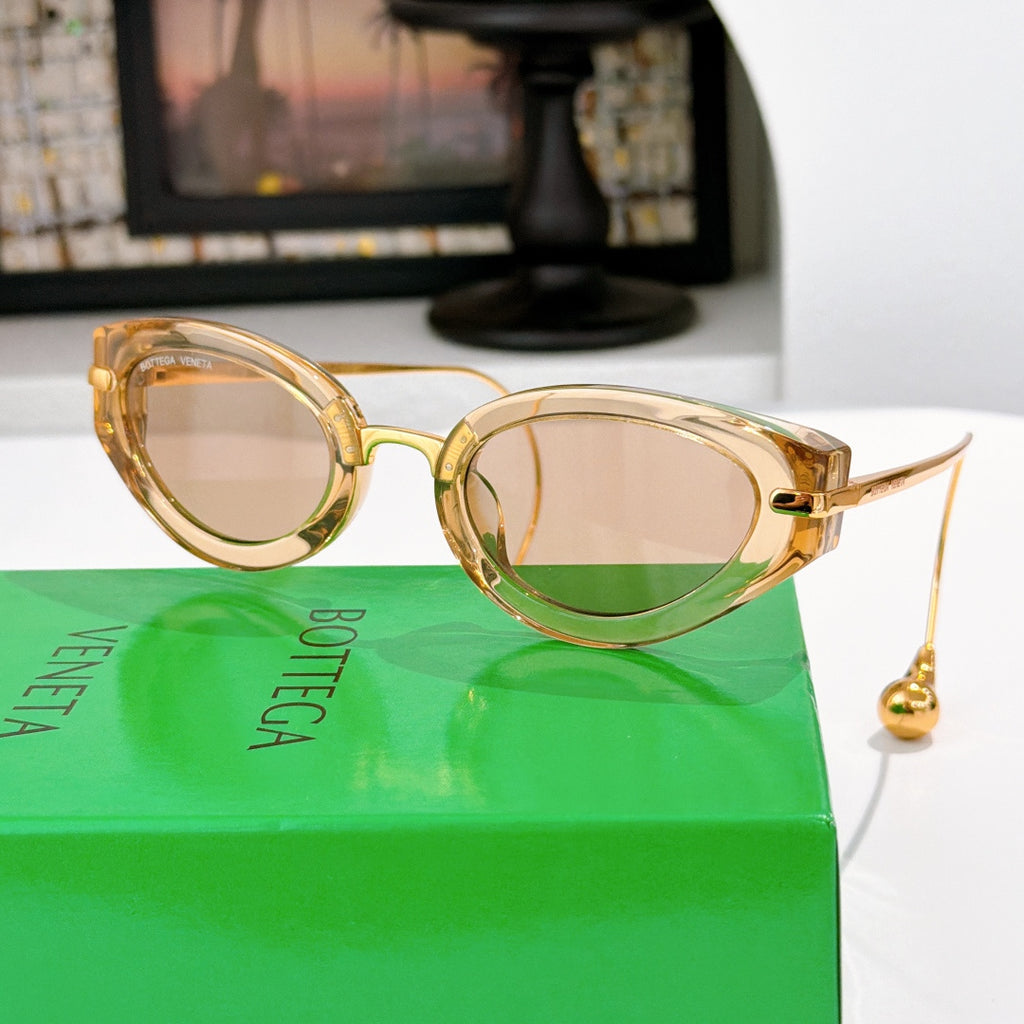 Bottega Veneta glasses with gold-tone frames and light rose tinted lenses, gold-tone details