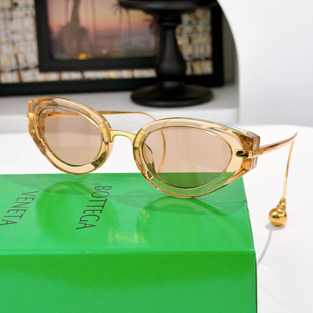 Bottega Veneta glasses with gold-tone frames and light rose tinted lenses, gold-tone details