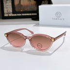 Round eyeglasses with pink frames and rose tinted lenses