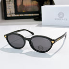 Round eyeglasses with black frames and dark tinted lenses