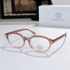 Round eyeglasses with light pink frames and clear lenses