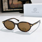 Round eyeglasses with dark tortoiseshell frames and brown tinted lenses