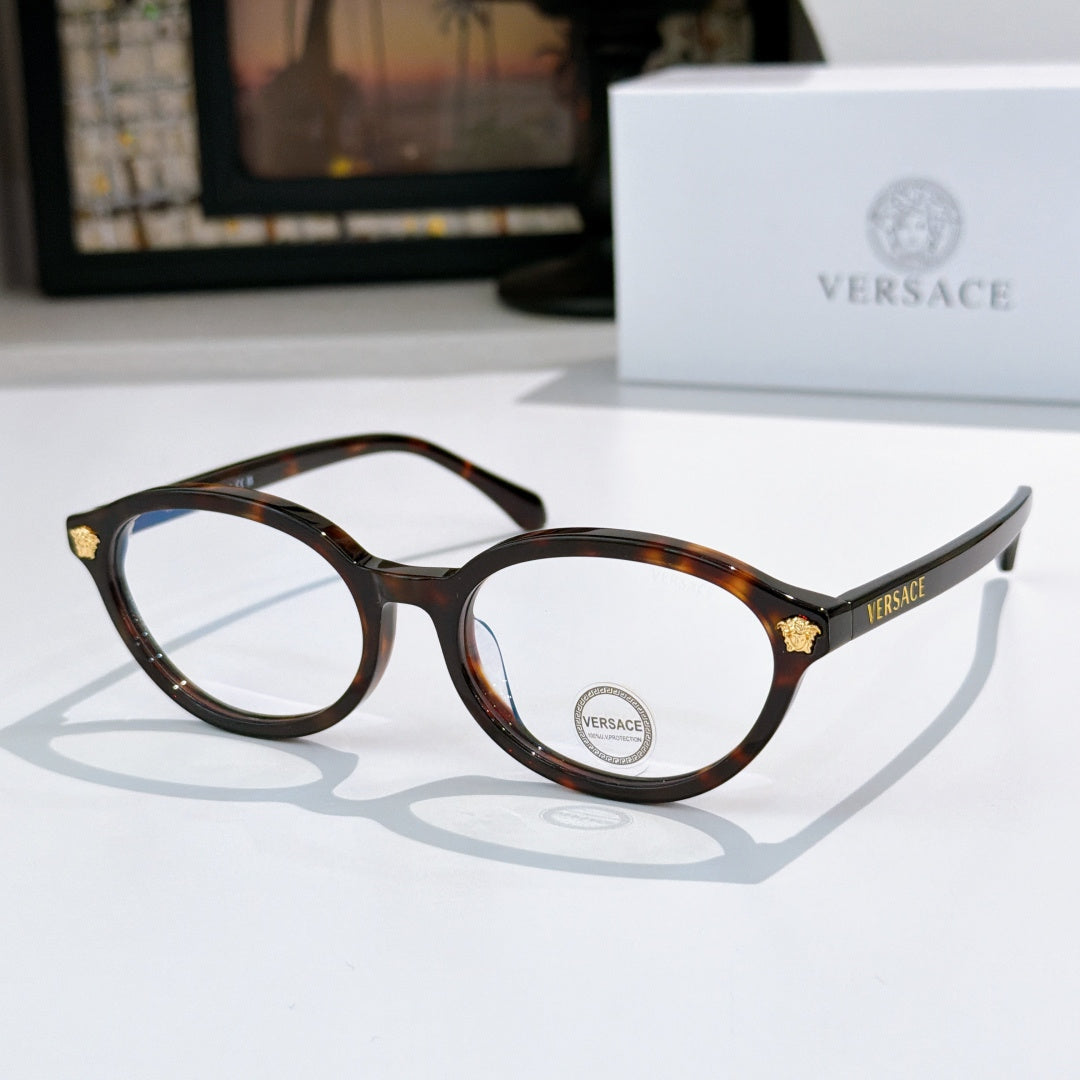 Round eyeglasses with dark tortoiseshell frames and clear lenses