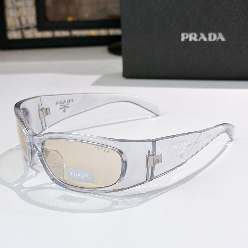 Prada clear frame glasses with beige lenses and metal logo arms