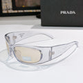 Prada clear frame glasses with beige lenses and metal logo arms