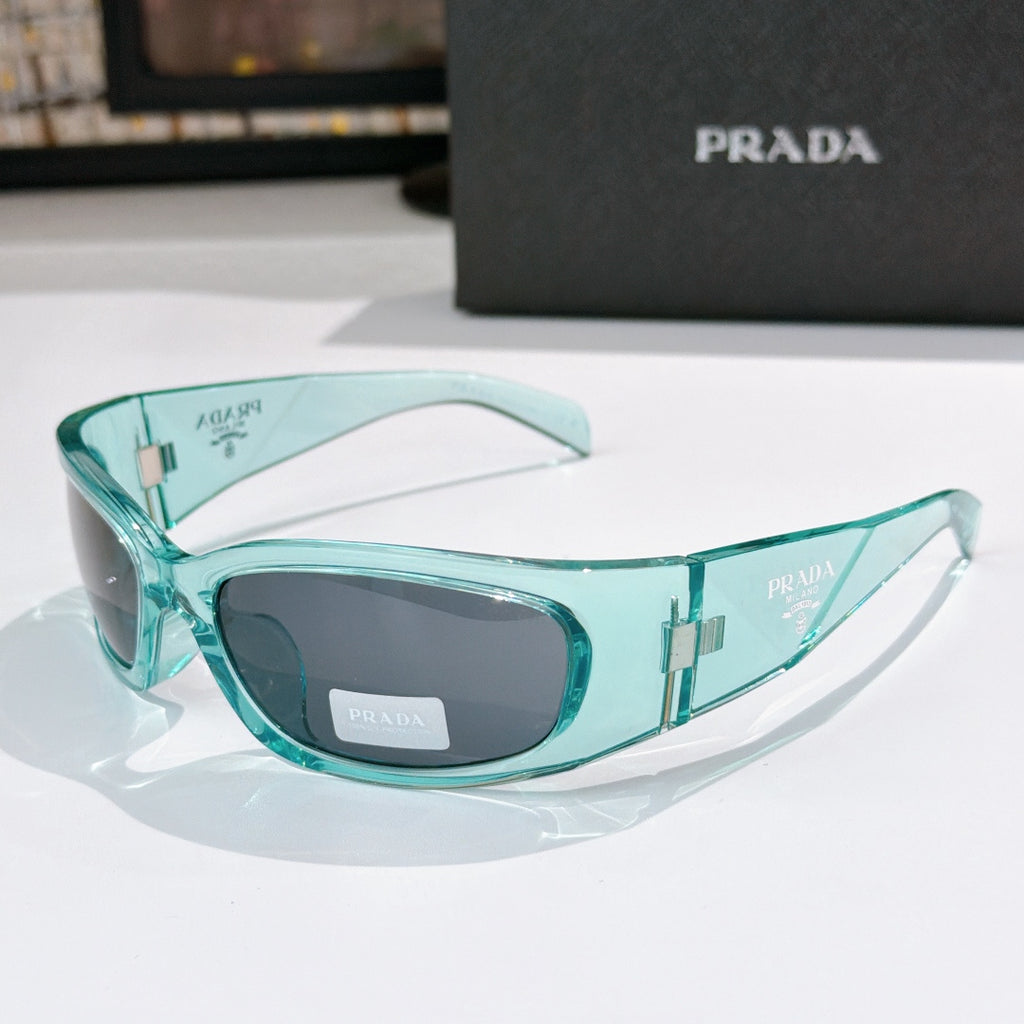Prada teal acetate glasses with dark lenses and gold-toned logo details